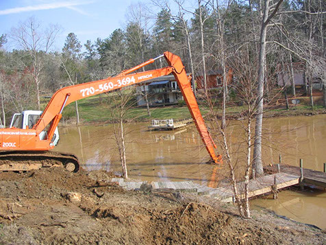 dredging a pond by hand